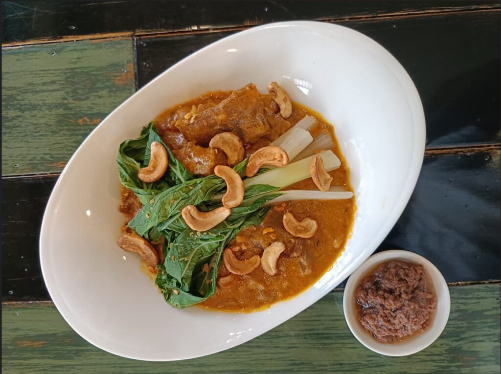 A plate of Kare-kare with cashew sauce from Restaurant in Coron